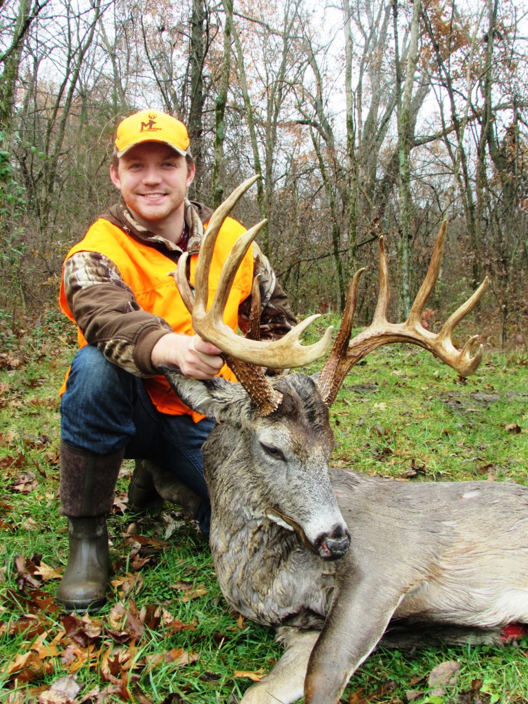 A Man Posing With The Hunted Deer