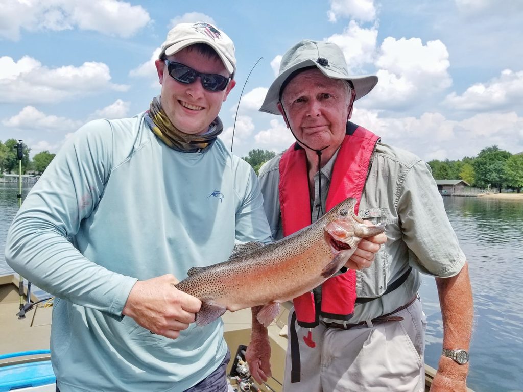 Grandson helps Grandpa catch giant rainbow trout