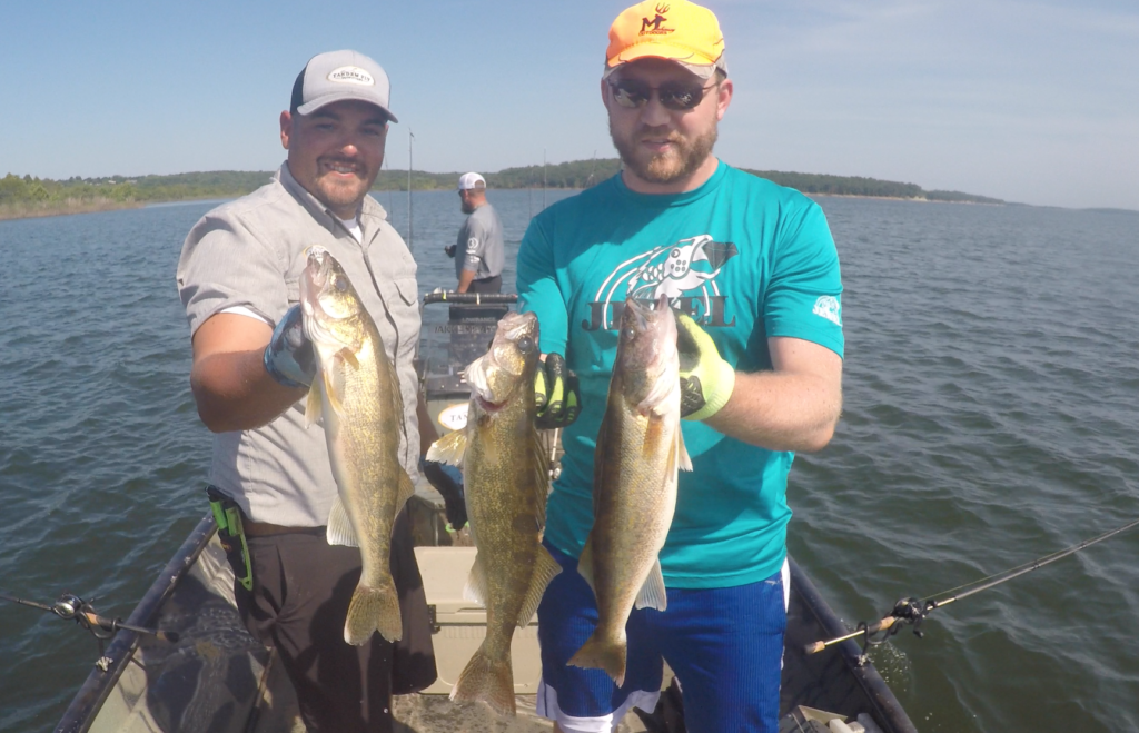 Two Men Showing the Fishes they Caught