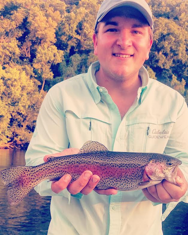 The author with a beautiful Lake Taneycomo rainbow.